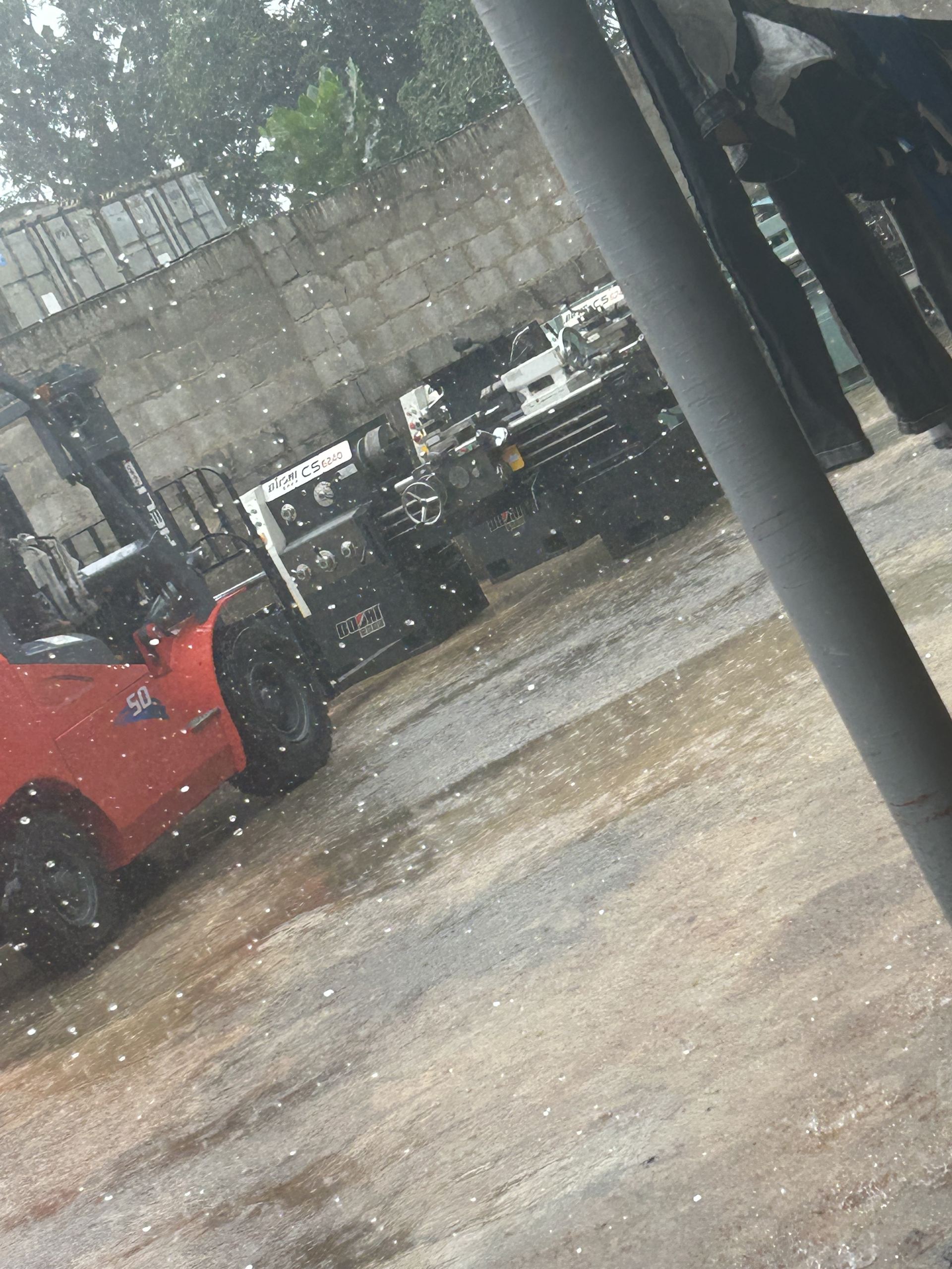 Machinery being offloaded from the shipping container